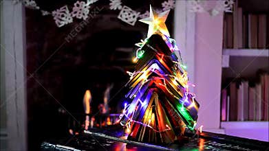 Vintage books Christmas tree and open fire.