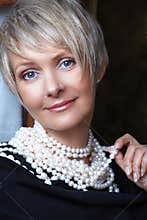 Woman in pearls in her 40s