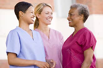 Nurses Standing Outside A Hospital