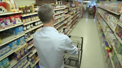 Pushing a shopping cart in a grocery store (4 of 4)