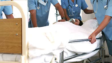 Team of doctor resuscitating a patient