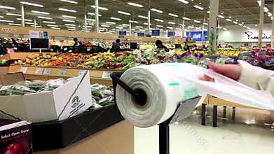Woman taking plastic bag for buying food