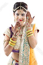 Beautiful Indian Bride with Mehendi hands or Henna