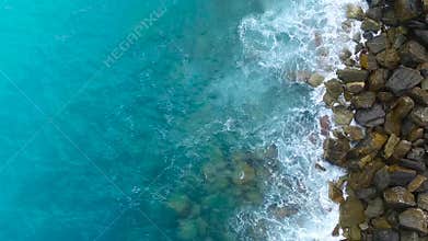 Aerial view on the sea waves and rocks, the Mediterranean sea.