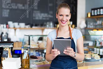 Woman working at cafe