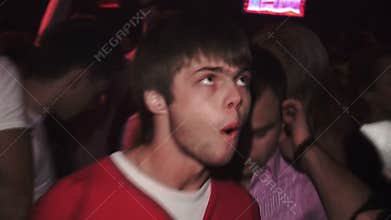 Guy under drugs dances at a big party at the club