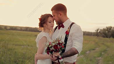 Beautiful young couple bride and groom standing in