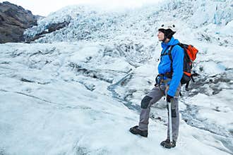 Alpinist climber on glacier