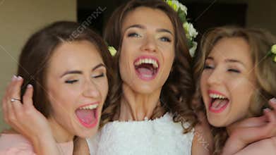 Faces of happy bride and her friends