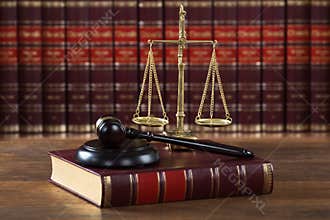 Mallet And Legal Book With Justice Scale On Table