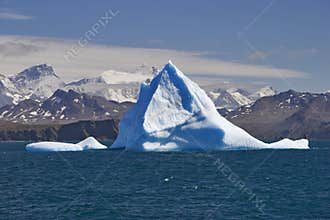 Blue iceberg with land