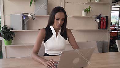 The end of the working day successful employee looking at the camera.