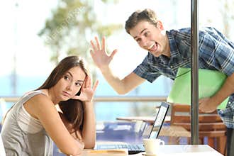 Girl ignoring a stalker man waving