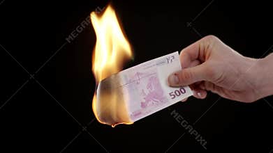 Burning five hundred Euro