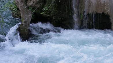 Large waterfall in the park in the summer