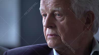 Senior man with an angry, troubled, restless and sad expression