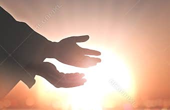Silhouette Hands Reaching Toward Bright Spiritual Light