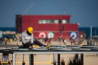 Barceloneta,Barcelona, Spain, March 2016: electrician work on a roof