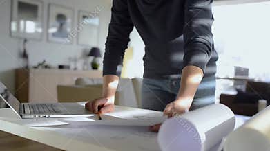 Architect working from home on computer, unrecognizaple man