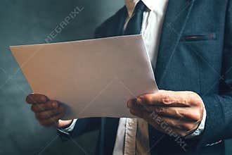 Businessman reading project documentation