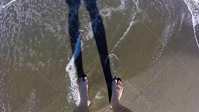 Tourist walking on the shore