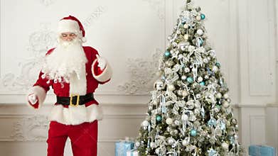Santa Claus doing modern dance next to the Christmas tree