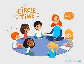 Kids listen and talk to friendly preschool teacher during educational activity in kindergarten. Learning through play