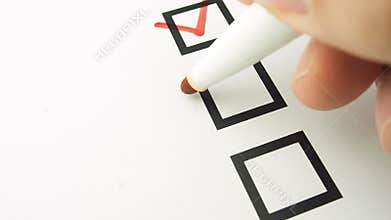 Male hand putting mark checkbox checklist