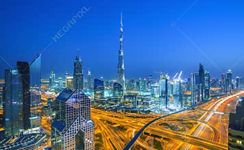 Dubai skyline at sunset with beautiful city center lights and Sheikh Zayed road traffic,Dubai,United Arab Emirates