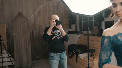 Model woman posing for a photograph in the studio