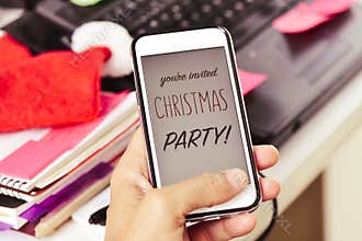 Text you are invited christmas party in a smartphone