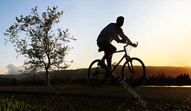 Man riding his bike