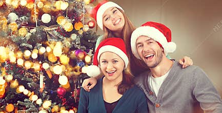 Christmas family portrait. Parents with teenage daughter
