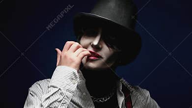 Girl with Halloween makeup posing in studio