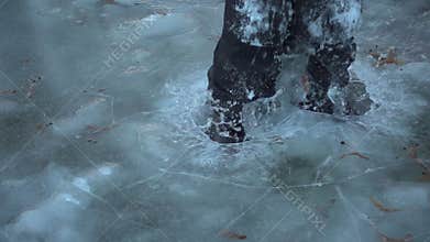 Boy jumping on thin ice, slow motion 250 fps