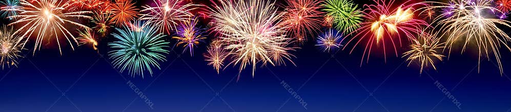 Colorful fireworks display on blue
