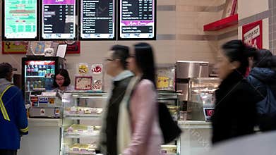 One side of people buying food at food pretzel makeer store