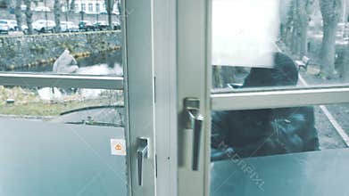 Burglar with crowbar break door to enter the house