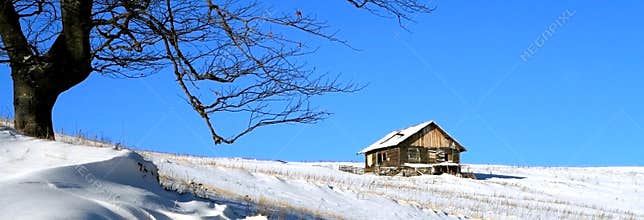 Chalet on blue sky
