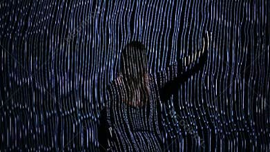 Girl play with interactive video installation