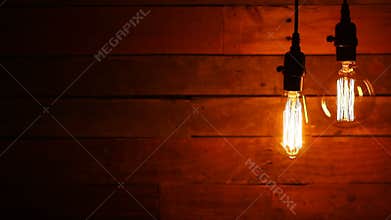 Urban Retro Hanging Light Bulbs on Wood Background