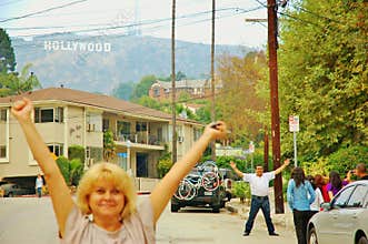 Happy smiling people nearby hollywood sign